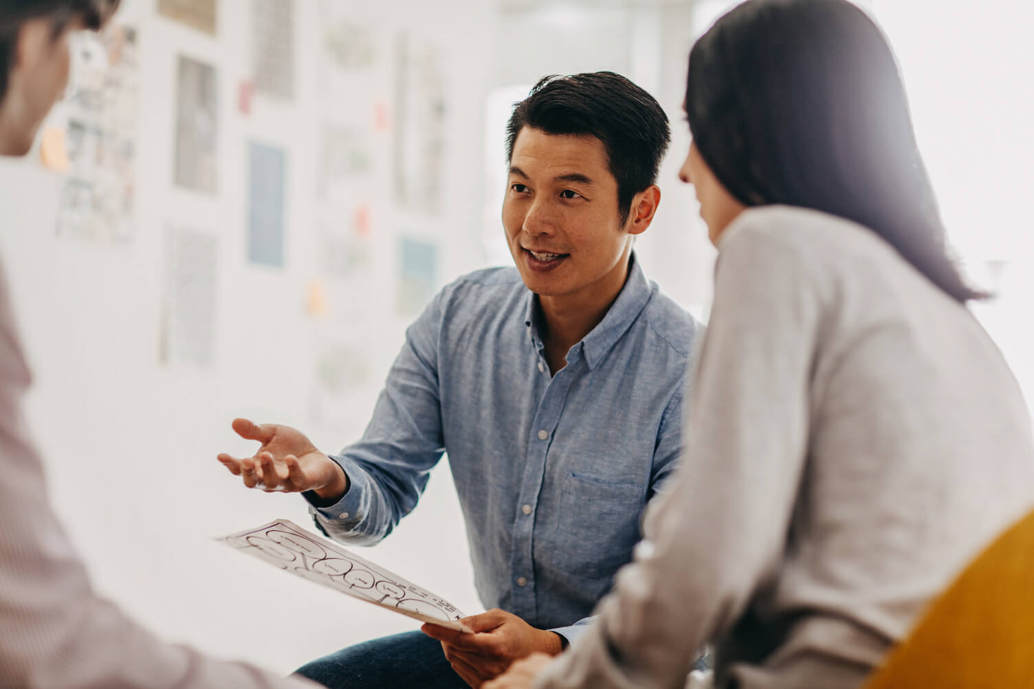 Man talking to his employees