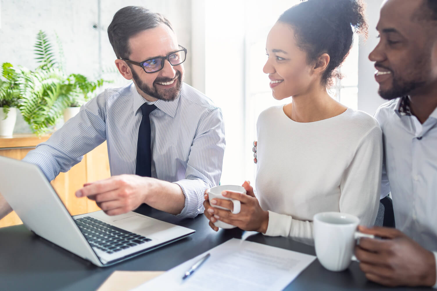 Businessman talking through proposition with potential customers