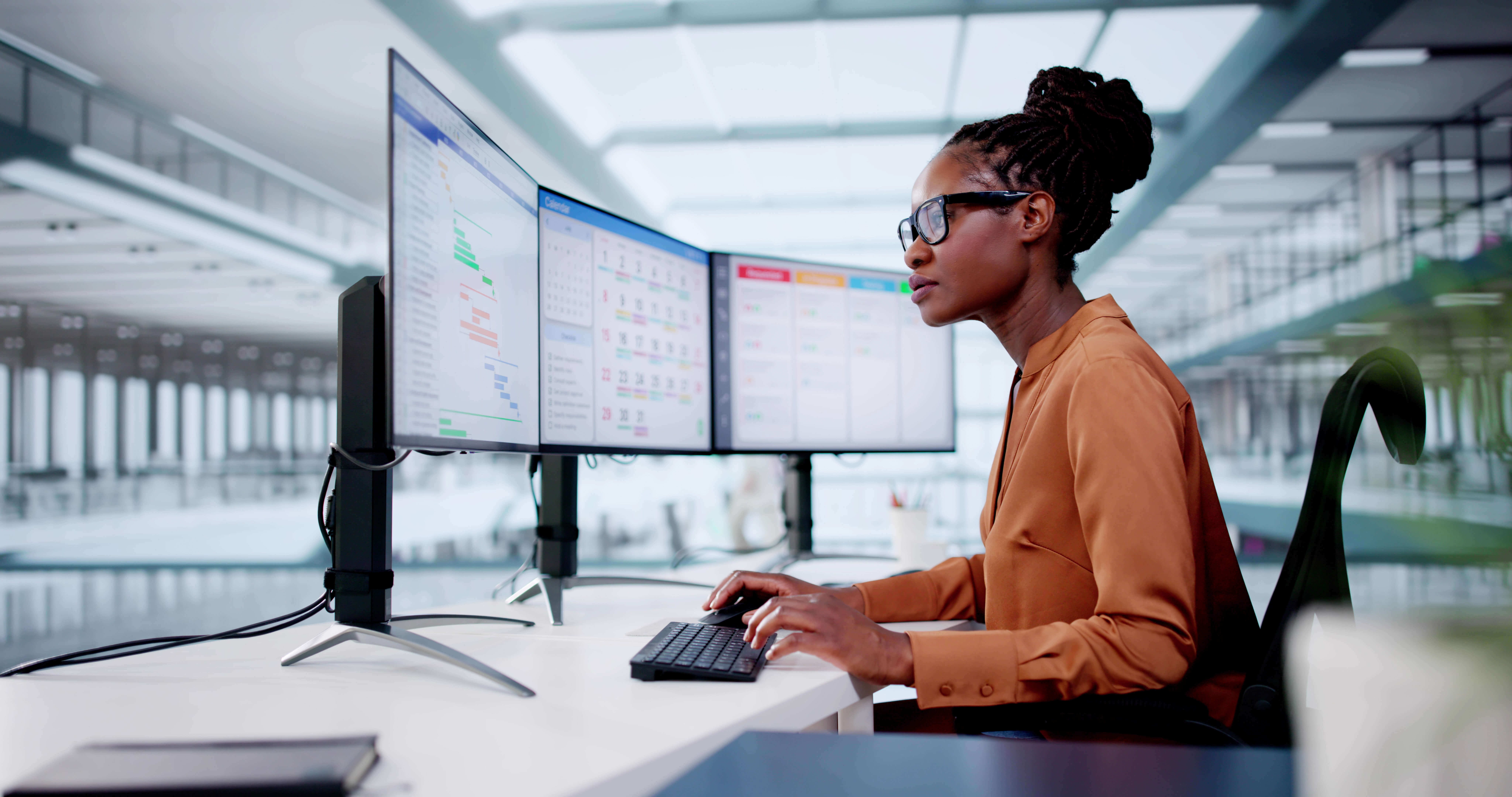 Woman looking over a computer screen