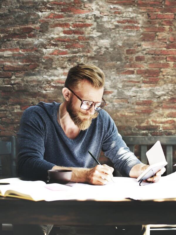 Man checking the compliancy of his customer records