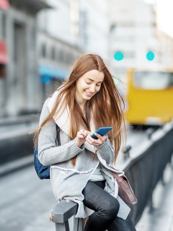 Woman waiting for a train at a station