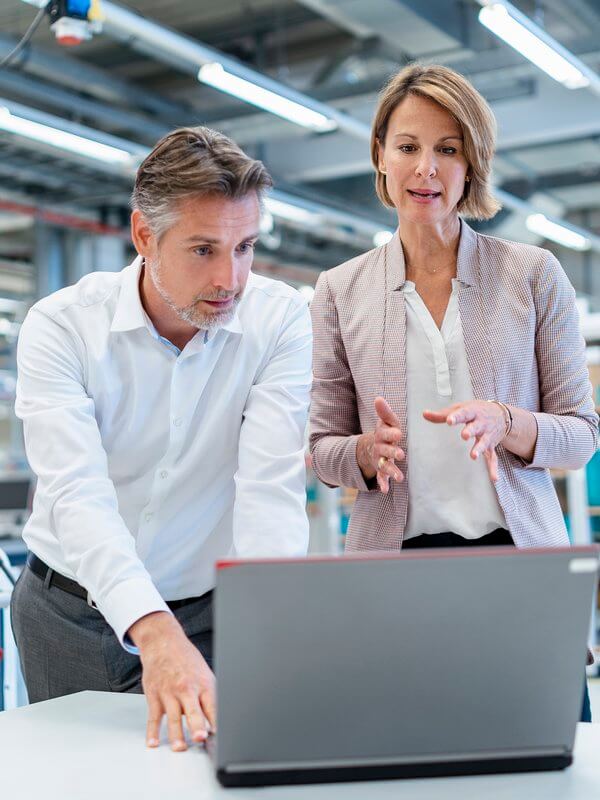 Colleagues checking compliancy of customer data
