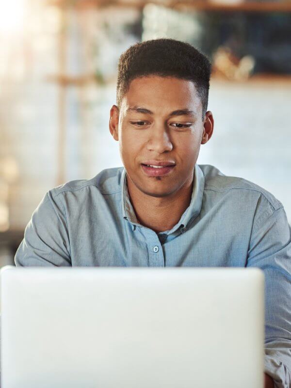 Man using a laptop while at home