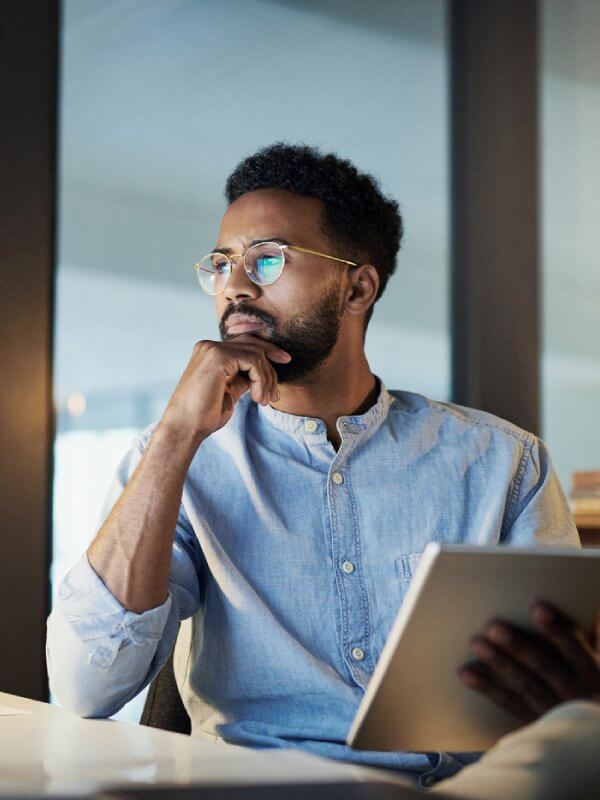 Man in an office deploying data model changes
